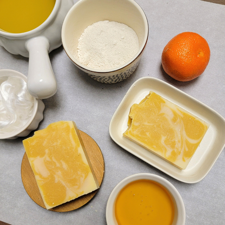 Energize your skin with Honey Tangerine Natural Handmade Soap, crafted with pure plant-based oils, butters, and luxurious silk fibers. Infused with real honey for deep hydration, this soap features a refreshing citrus essential oil blend that invigorates the senses. Kaolin clay and yellow clay gently cleanse, while aloe vera juice soothes and softens, making this the perfect everyday bar for a fresh, radiant glow.