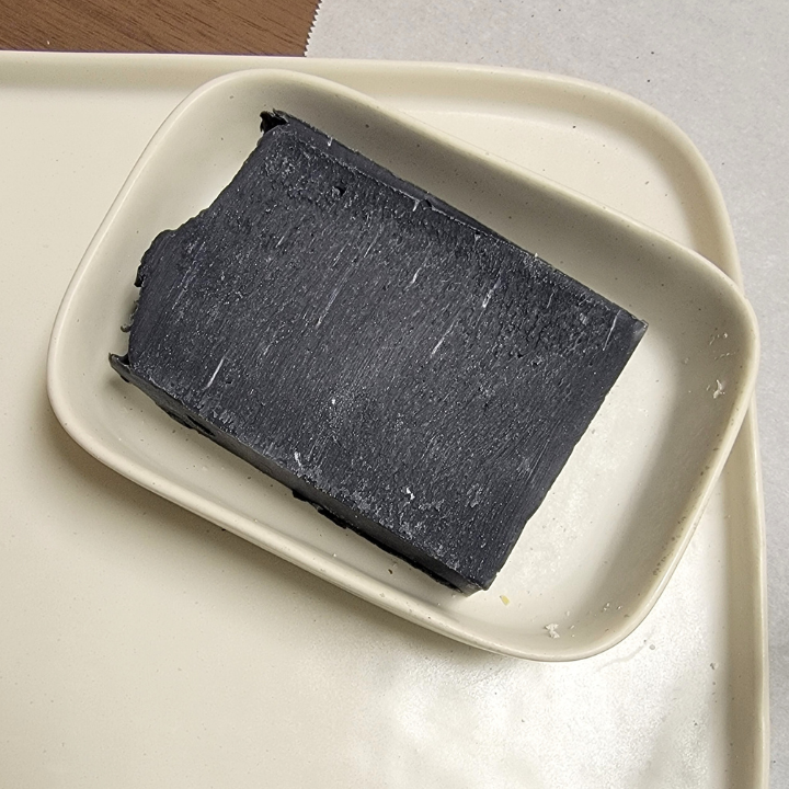 Midnight Calm Natural Handmade Soap – Detoxifying & Soothing
Experience the ultimate cleanse with Midnight Calm Natural Handmade Soap, a luxurious blend of activated charcoal, calamine clay, and kaolin clay designed to purify, balance, and refresh your skin. Infused with tea tree, rosemary, star anise, and spearmint essential oils, this invigorating soap delivers a spa-like experience while aloe vera juice and nourishing butters deeply hydrate and protect. The addition of silk fibers creates a rich, creamy